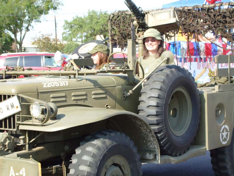 photo of woman in army vehicle